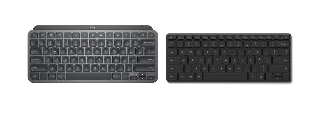 Microsoft compact keyboard. Logitech MX Keys pale Grey.